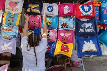 Incarcerated women sell cushions outside the National Women's Penitentiary for Social Adaptation (PNFAS), in the region of Támara, near Tegucigalpa, Honduras