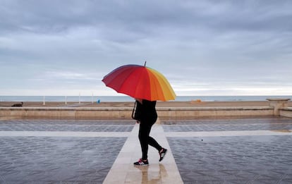 Rain falls in Malvarrosa beach in Valencia on Sunday.