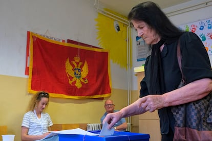 A woman casts her ballot at a polling station in Montenegro's capital Podgorica