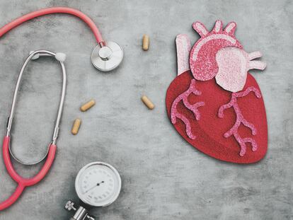anatomical heart made of felt textile in red background