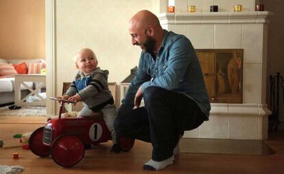 Pablo Capa plays with his 15-month-old son at his house in Kirkkonummi, Finland.