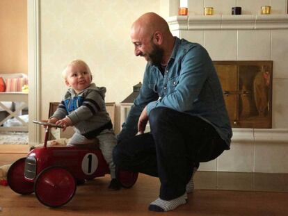 Pablo Capa plays with his 15-month-old son at his house in Kirkkonummi, Finland.