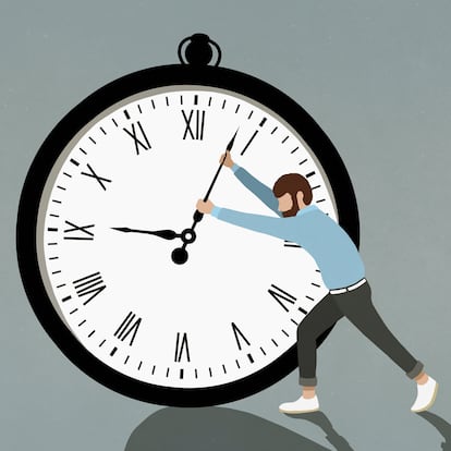 Man pushing hands of large stopwatch