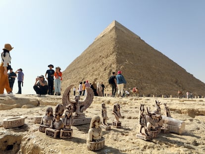 Tourists at the pyramids of the Giza plateau in Cairo, Egypt.