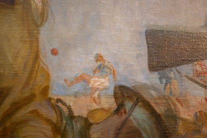 A soldier plays soccer, in the background of Singer Sargent's painting.