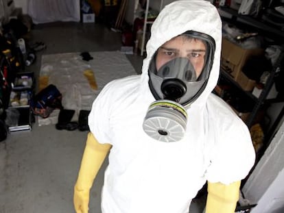 An employee from DEP Limpiezas Traumáticas. The company's protective masks are second only to those used at radioactive leak sites.