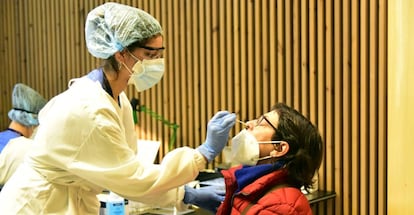 A health worker carries out a PCR test at San Pau hospital in Barcelona.