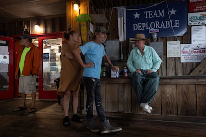 People gather at a marina convenience store as Hurricane Helene intensifies before its expected landfall on Florida’s Big Bend, in Carrabell, Florida.