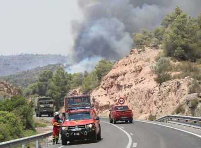 Roads have been cut off to traffic as firefighters struggle to contain the flames.