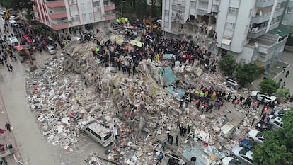 People search through rubble following an earthquake in Adana, Turkey.