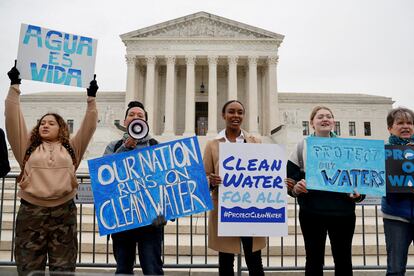 Environmental activists gather outside the U.S. Supreme Court in Washington, on October 3, 2022.