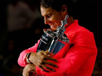 Nadal holds the US Open trophy in New York.