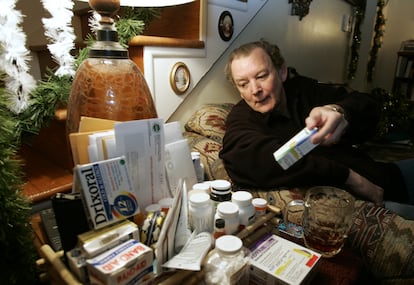 Anthrax attack victim David Hose sorts through a basket full of medications in his home in Winchester, Va., Tuesday Dec. 8, 2004