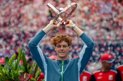 Jannik Sinner of Italy holds the trophy after defeating Alex De Minaur of Australia during the men's final match at the 2023 National Bank Open tennis tournament in Toronto, Canada, 13 August 2023.