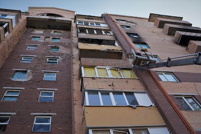 Artillery damage marks the facade of a building in Irpin. 