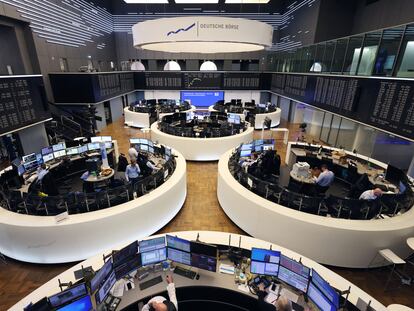 Brokers are pictured at the stock exchange in Frankfurt, western Germany, on February 27, 2024