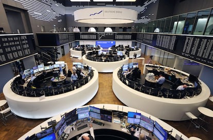 Brokers are pictured at the stock exchange in Frankfurt, western Germany, on February 27, 2024