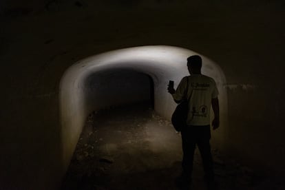 Carlos Jordán, from the San Roque tourism department, shines his flashlight on the tunnel that stretches around 500 meters under the Sierra Carbonera in La Línea de la Concepción.