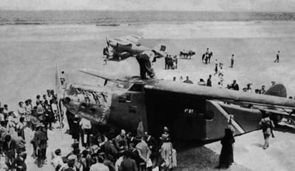 The Yellow Bird on Oyambre beach with the plane sent with extra fuel for the onward flight to Paris in the background.