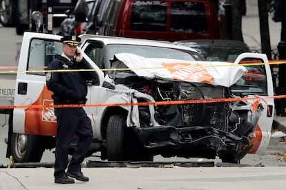 A damaged Home Depot truck remains on the scene, Nov. 1, 2017, after the driver mowed down people on a riverfront bike path near the World Trade Center on Tuesday, in New York.