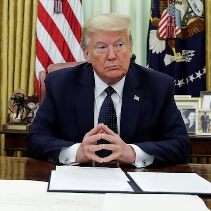 FILE PHOTO: U.S. President Donald Trump is seated prior to signing an executive order regarding social media companies in the Oval Office of the White House in Washington, U.S., May 28, 2020. REUTERS/Jonathan Ernst/File Photo