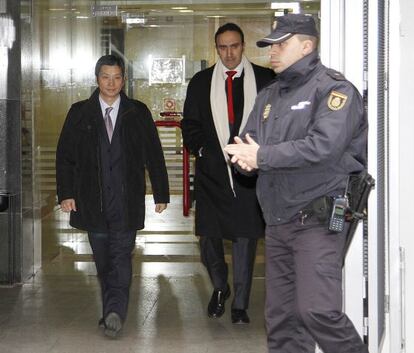 Gao Ping arrives at the High Court, where he must register daily, after being released from custody. 