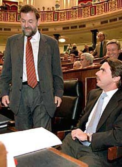 Mariano Rajoy y José María Aznar, en una sesión del Congreso.