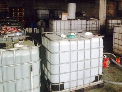 Plastic vats filled with alcohol in en Maside (Ourense)