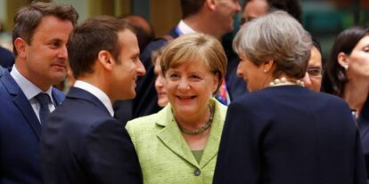 Emmanuel Macron, Angela Merkel y Theresa May.