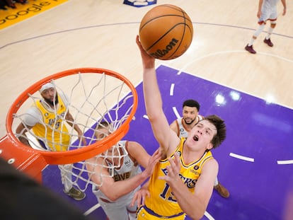 Los Angeles Lakers guard Austin Reaves, front right, drives to the basket against the Denver Nuggets in the first half of Game 4 of the NBA basketball Western Conference Final series May 22, 2023, in Los Angeles.