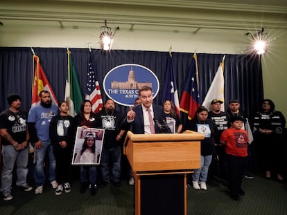 Family of those killed by a gunman at Robb Elementary School in Uvalde, Texas, stand with Texas State Sen. Roland Gutierrez, center, during a news conference at the Texas Capitol in Austin, Texas, on Jan. 24, 2023