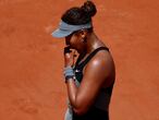 FILE PHOTO: Tennis - French Open - Roland Garros, Paris, France - May 30, 2021 Japan's Naomi Osaka reacts during her first round match against Romania's Patricia Maria Tig REUTERS/Christian Hartmann/File Photo