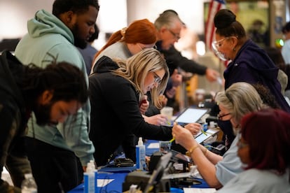 People check in to cast their votes at a polling station in a mall on November 8, 2022, in Las Vegas.