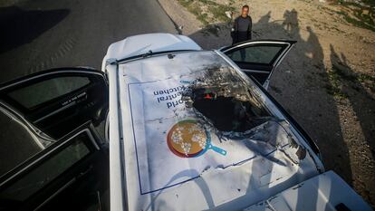 A destroyed car bearing the logo of World Central Kitchen (WCK) as it sits along Al Rashid road, between Deir Al Balah and Khan Younis in the southern Gaza Strip, on April 2. 