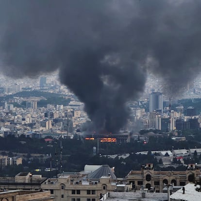 TEHRAN, IRAN - JUNE 16: Smoke rises after a reported Israeli strike on a building used by Islamic Republic of Iran News Network, part of Iran's state TV broadcaster, on June 16, 2025 in Tehran, Iran. Over recent days, Iran has been hit by a series of Israeli airstrikes targeting military and nuclear sites, as well as top military officials, prompting Iran to launch a counterattack. (Photo by Stringer/Getty Images)
