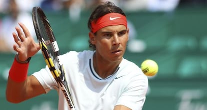 Rafa Nadal returns the ball to Australian Marinko Matosevic.