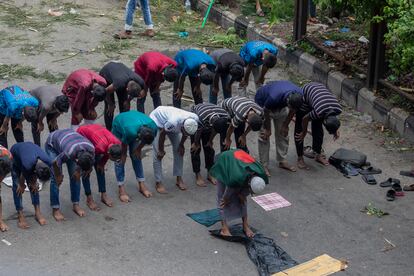 Protesters pray during protests against Prime Minister Sheikh Hasina on Sunday, May 4.