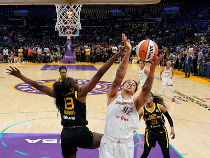 Los Angeles Sparks forward Chiney Ogwumike (13) defends against Phoenix Mercury center Brittney Griner (42) during the first half of a WNBA basketball game in Los Angeles, Friday, May 19, 2023.