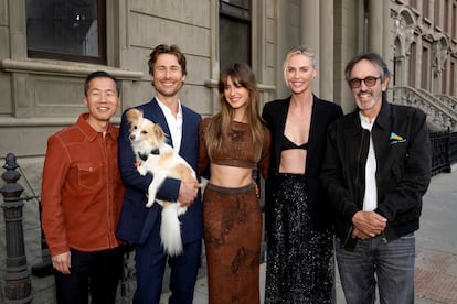 Actors Lee Isaac Chung, Glen Powell, Daisy Edgar-Jones, Charlize Theron and Patrick Crowley attend a charity event for Charlize Theron's Africa Outreach Project (CTAOP) on July 13, 2024 in Universal City, California. Powell was accompanied by his dog Brisket.