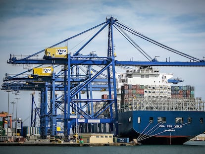 A ship loading containers in the port of Valencia.