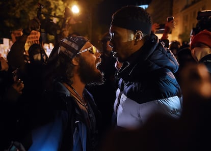 A Donald Trump supporter (l) clashes with a demonstrator at Black Lives Matter plaza across from the White House on election day in Washington, DC on November 3, 2020.