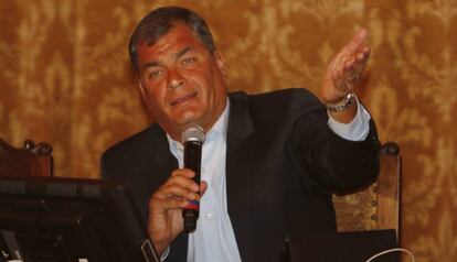 President Correa announces tax hikes at a press conference.