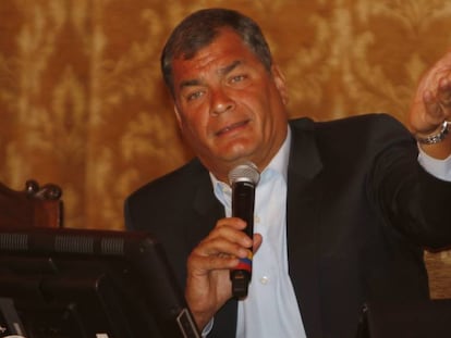 President Correa announces tax hikes at a press conference.