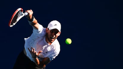 Austria's Dominic Thiem serves Germany's Dominik Koepfer during their second round match at the Australian Open tennis championship in Melbourne, Australia, Wednesday, Feb. 10, 2021.(AP Photo/Rick Rycroft)
