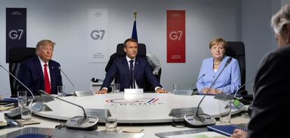 El presidente de EE UU, Donald Trump; e presidente francés, Emmanuel Macron, y la canciller alemana, Angela Merkel