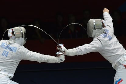The Italian Aldo Montano (left) faces the Russian Alexey Yakimenko during the competition for the Bronze Medal of Fencing.