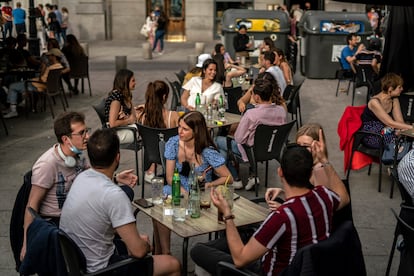 A sidewalk café in Santa Ana square in Madrid.