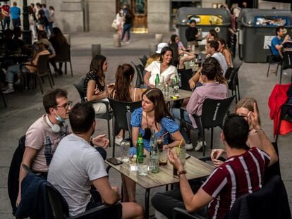 A sidewalk café in Santa Ana square in Madrid.