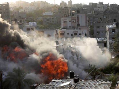 Smoke and fire rise from an explosion caused by an Israeli airstrike targeting a building in Gaza, Saturday, May 13, 2023. The building was owned by an Islamic Jihad official.
