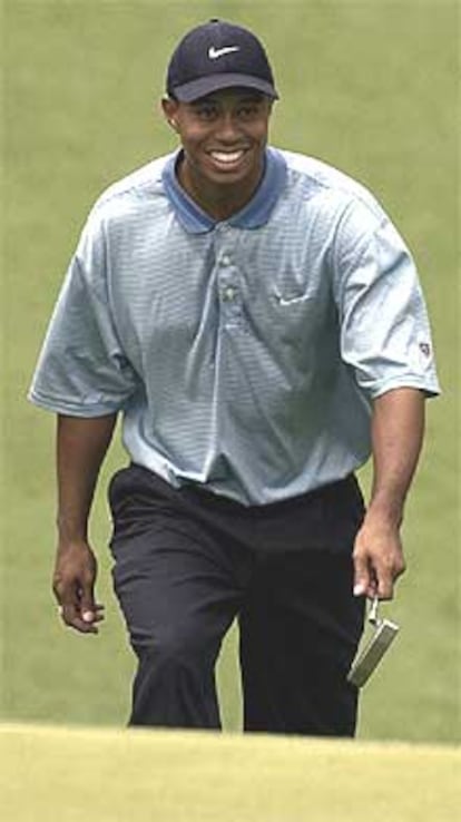 Tiger Woods, sonriente por las calles de Augusta.
